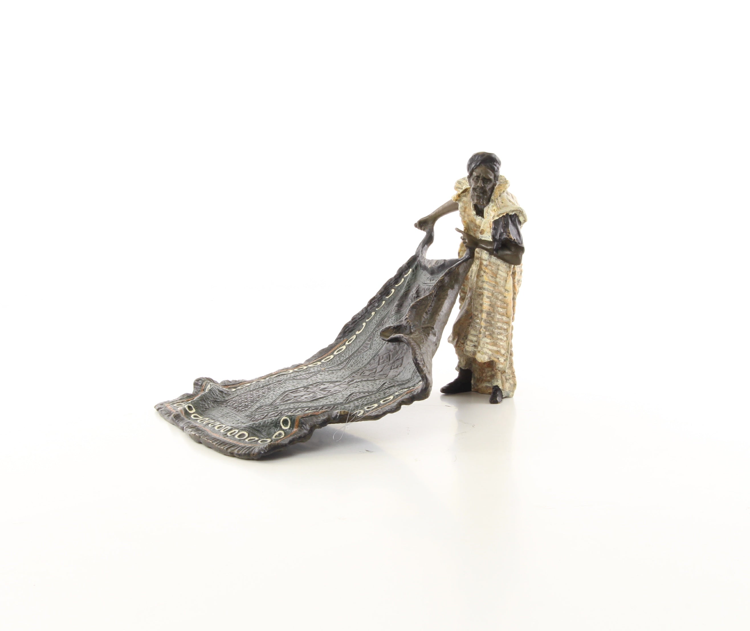 Bronzen tapijtverkoper sculptuur