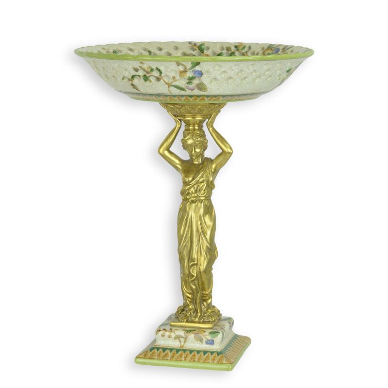 Porseleinen schaal op stand met goudkleurige bronzen montuur en draagfigurine, 33,2 cm